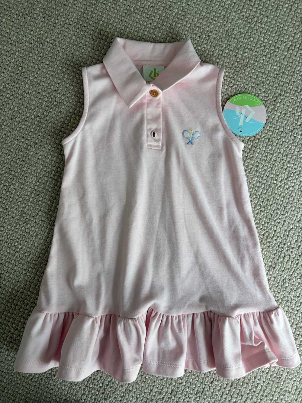 Girls Pale Pink Sleeveless Polo Dress with Ruffle Hem. New with tags.